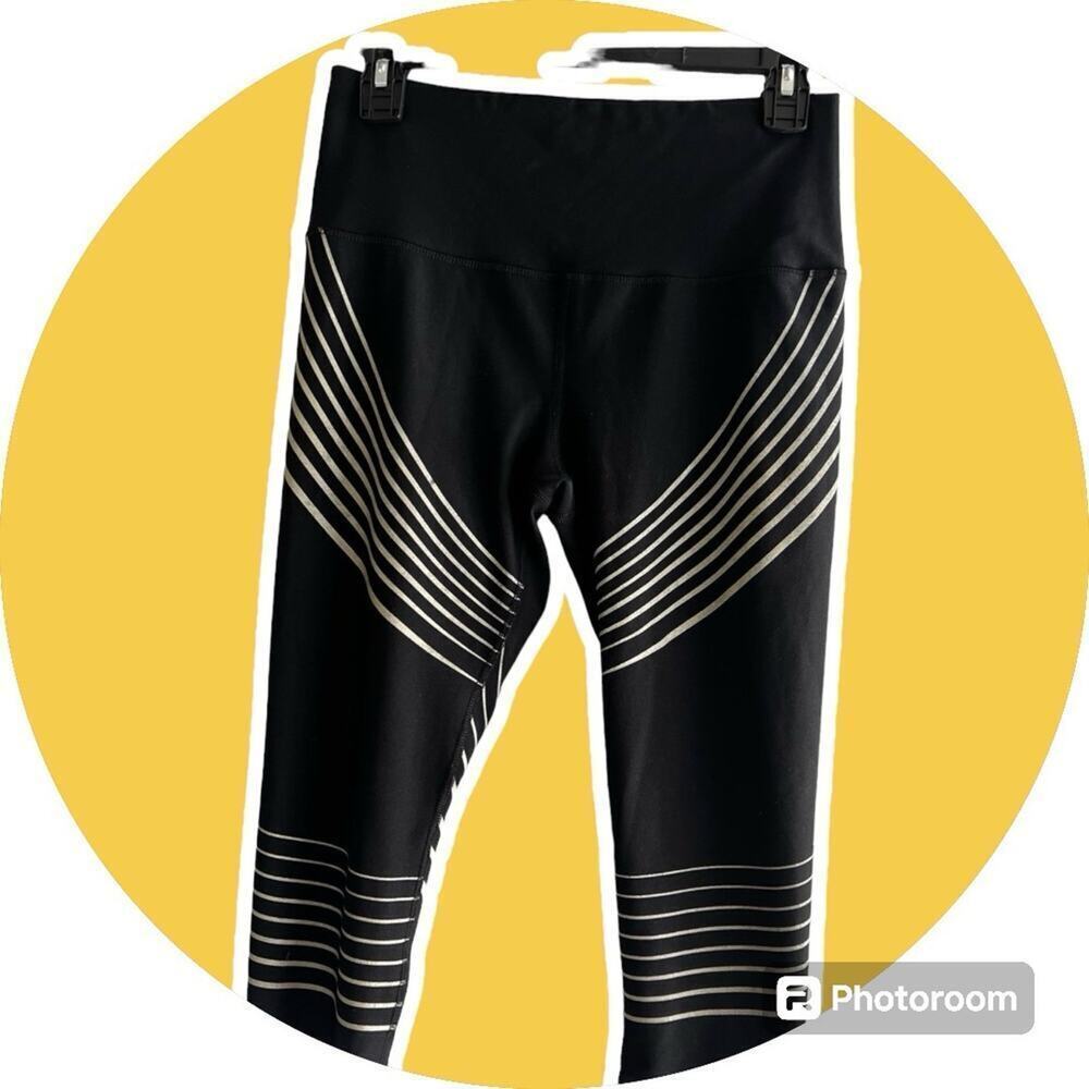 RBX leggings, capri, women's size S, Black with gold stripes.
